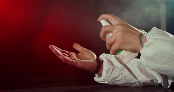 Male Hand Spray Disinfect Sanitize. Give Slap Man in Mask Covid-19. Coronavirus. alt