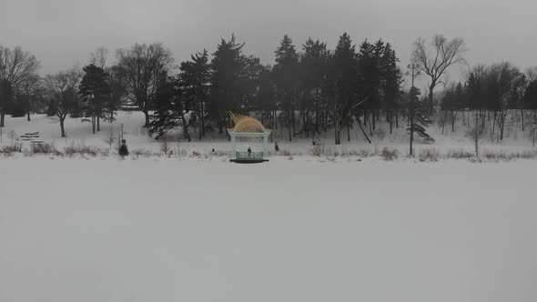 Park covered by snow, winter time alt