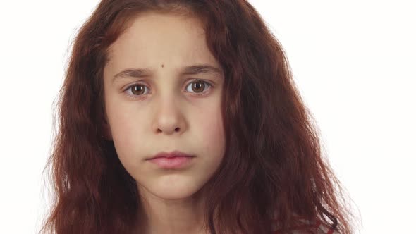 A Sweet Girl Asks for Silence and Turns Her Head To the Right and To the Left alt