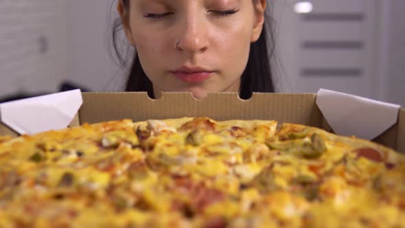 Woman with Eating Disorder Looking at Pizza