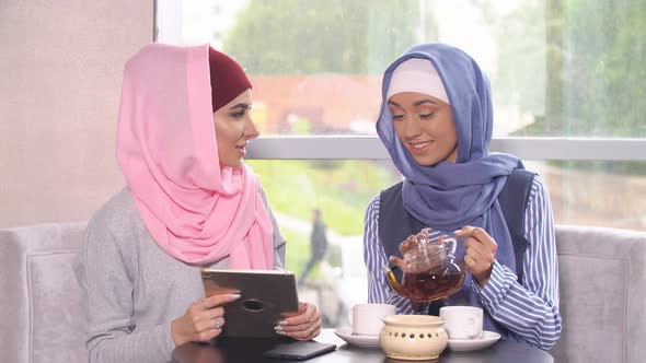 Muslim Women Talk in Cafes and Use Mobile Phones
