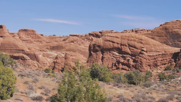 Red Orange Monolithic Rocks Formation In Arches Park On Sunny Day In Motion alt