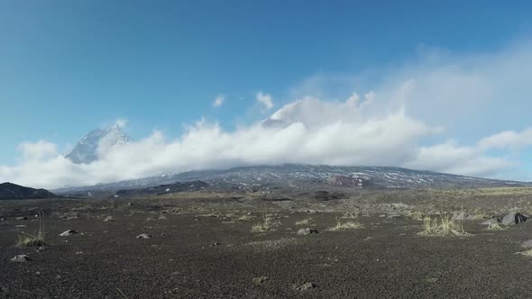 View of Volcanoes with Change of Clouds on Background Blue Sky