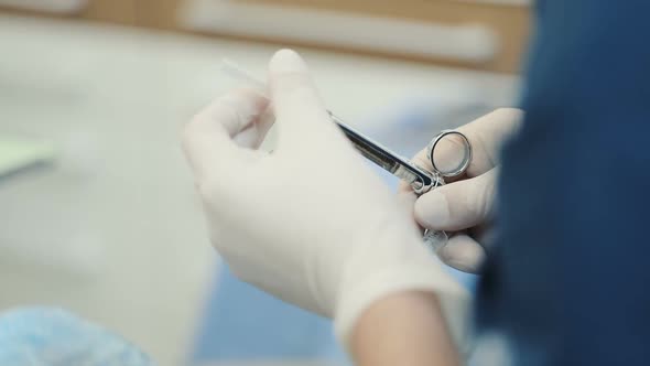 Doctor Holding Syringe with Dental Anesthetic alt