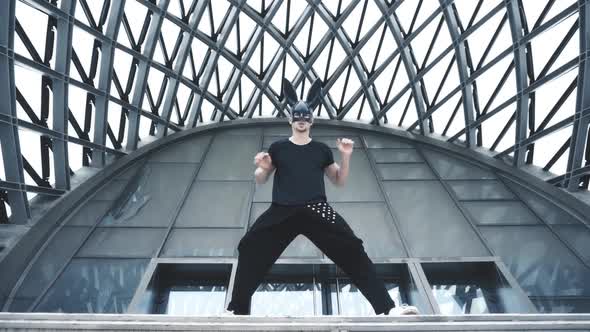 Man Dance in Mask in City alt