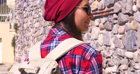Woman Tourist With Backpack Walks In European Old Town.