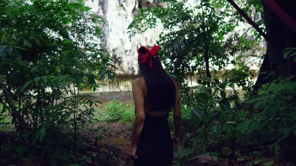 Cute Asian Girl Walking in the Jungle Towards the River Thailand