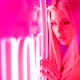 Portrait of a Blonde Beauty in a Pink Room with Neon Light Stands Against the Wall - VideoHive Item for Sale