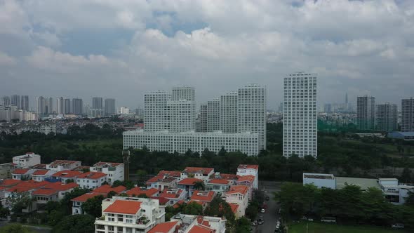 Ultra modern city development with residential and commercial high rise buildings, villas, green spa alt