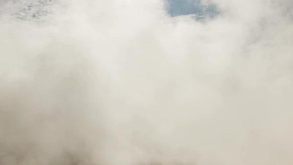 Clouds over mountains alt