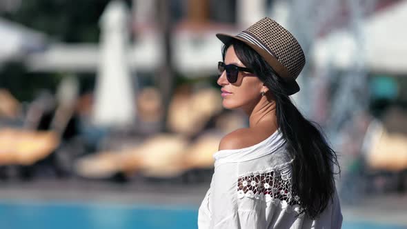 Fashionable Brunette Elegant Lady Enjoying Summer Travel Vacation at Tropical Resort with Waterfall alt