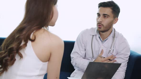 doctor takes a patient in the office of aesthetic medicine alt