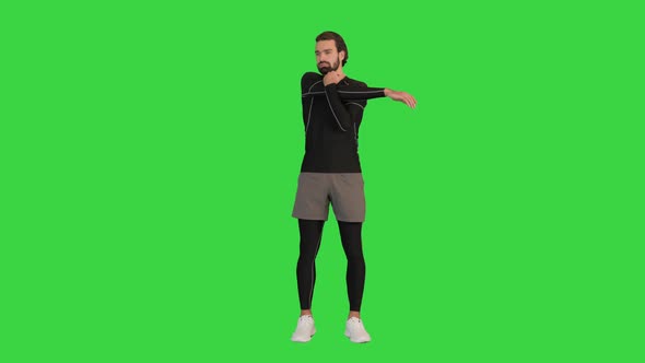Fitness Man Doing Warm Up Exercises on a Green Screen Chroma Key alt