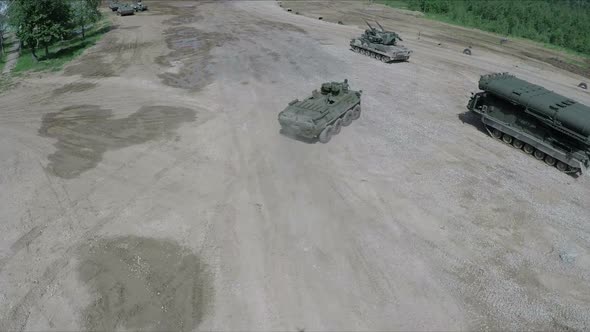 Flying Over Military Vehicles on Shooting Ground alt