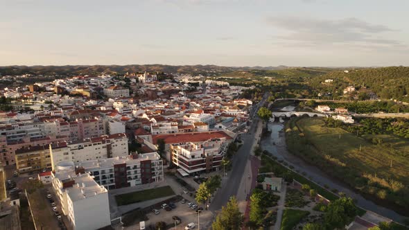 Aerial orbit shot over Silves town and Arade River in the Algarve, Portugal alt
