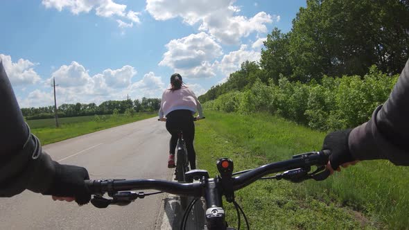 Cyclists Riding on His Bikes on Road alt