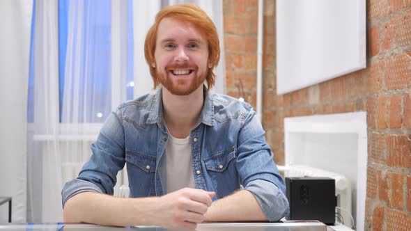 Laughing Redhead Beard Man Pointing with Finger at Camera alt