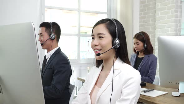 Asian business team working in call center as the operators