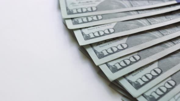 100 US dollar bill close up, the image is rotated.	 alt