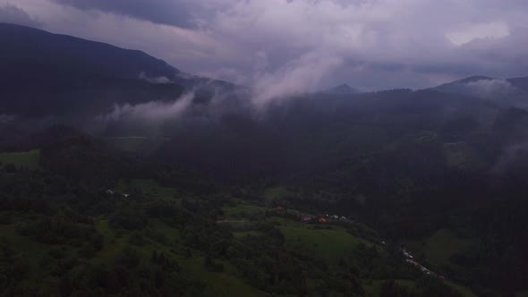Flying Over the Misty Mountains and Hills in the Countryside