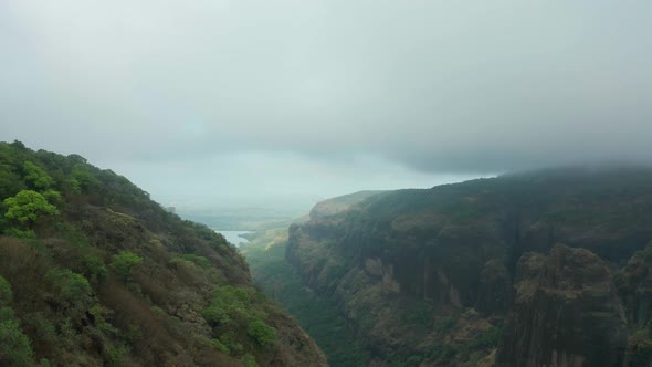 Thick Gray Clouds Over Western Ghats Mountain Range In  Mulshi, India During Monsoon Season - aerial alt