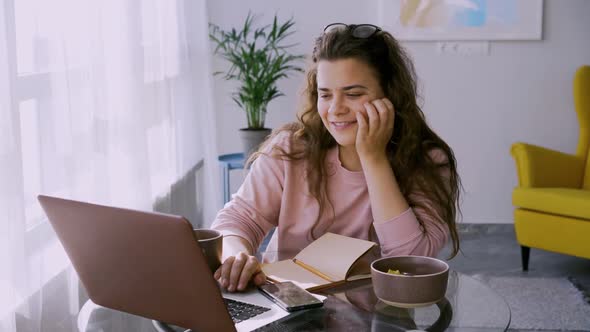 Pretty Woman Has Breakfast on Workplace at Home