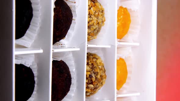 Different Candies Lie in Designed Paper Box at Confectionery alt