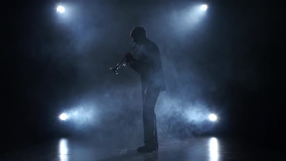 Musician in a Smoky Studio Playing in a Trumpet alt