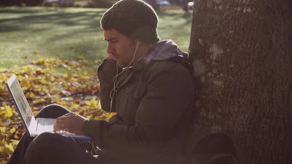 College student on campus using laptop computer