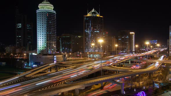 Beijing Business City Night Aerial Cityscape with Road Traffic China Zoom Out alt