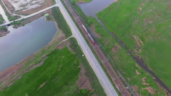 View From the Drone on the Railway Tracks Along Which the Locomotive Moves alt