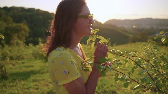 Young Woman is Enjoying By Nature in Farm Garden in Highland alt