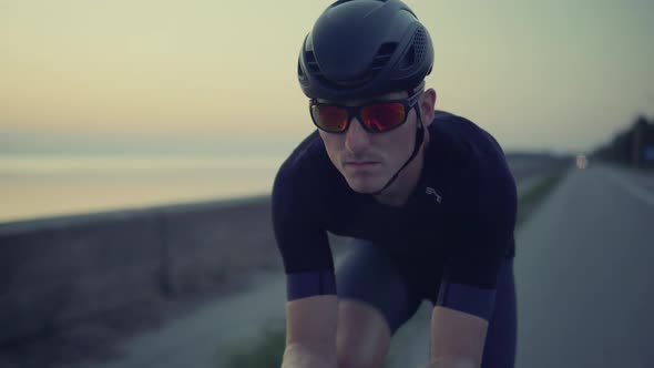 Cycling Exercise On Bike. Cyclist Professional Fit Man On Triathlon Bicycle.Triathlete Training. alt