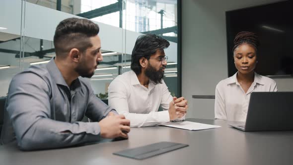 Multiethnic Business Team Diverse People Brainstorm in Office Two Arabian Men and African Woman alt