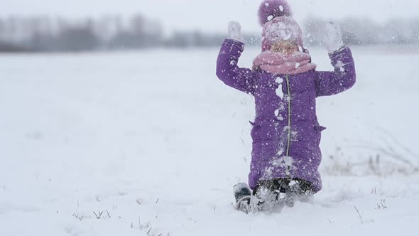 Cheerful child enjoying beautiful winter day.