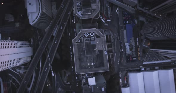 Flying Over Tall Skyscrapers In A Downtown District Of A Major City