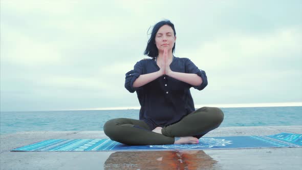 Meditation. Yoga Young Calm Brunette Woman By the Sea on Pier Relaxing in Serene Zen. Lotus Yoga alt