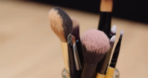 Makeup Brush Set on Table Rotating alt