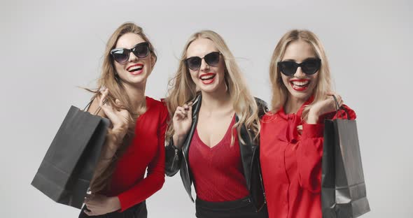 Happy Women with Shopping Bags