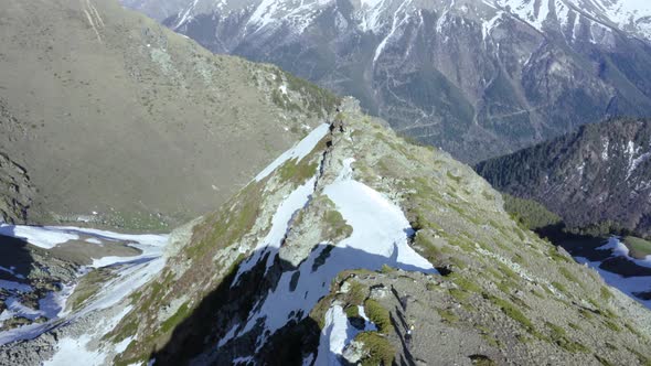 Aerial View at Group of Tourists Walking on Ridge of the Khodyuk Pass