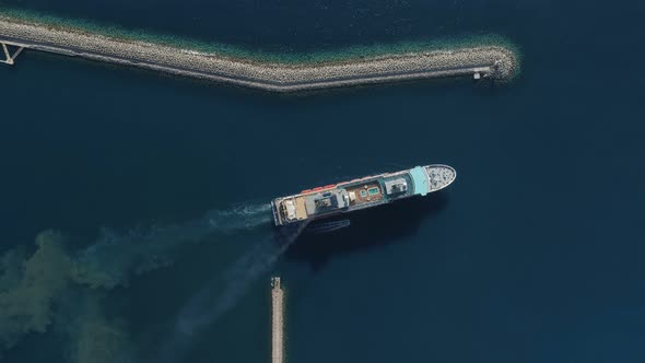 Aerial View of Luxury Medium Cruise Ship Sailing From Port