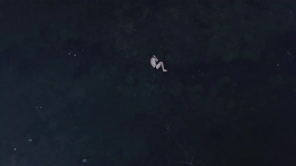 Young man on the ice. Top view of  frozen Lake  in Montenegro alt
