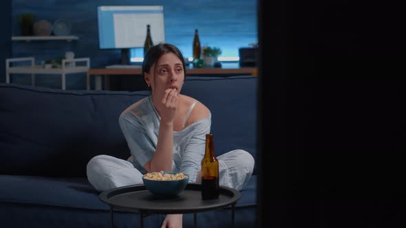 Sad Woman Crying Watching Drama Movie on Tv Sitting Sofa Eating Popcorn alt