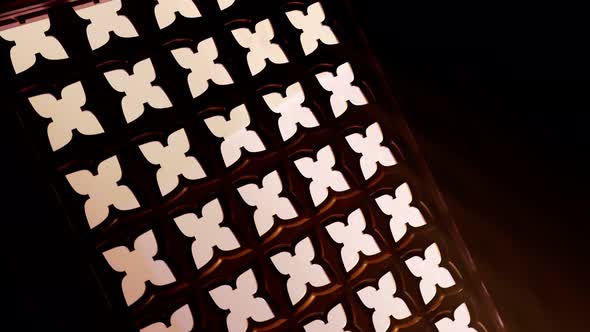 Holy Bible in rays of light falling into a confessional. Christian chapel detail alt