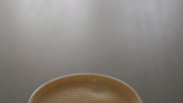 Fresh espresso coffee on table panning 4K 2160p UHD video - Delicious coffee cream in the cup 4K 384 alt