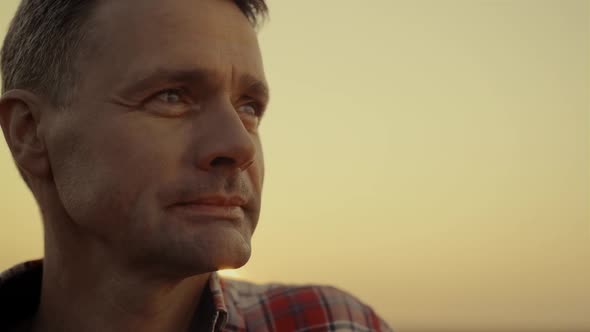 Portrait Farmer Looking Field at Golden Sunset Close Up alt