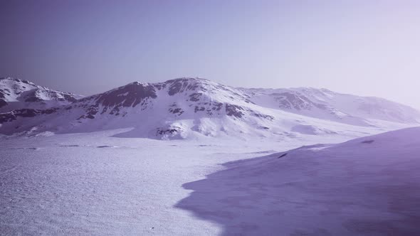 Snowed Mountains in Alaska with Fog alt
