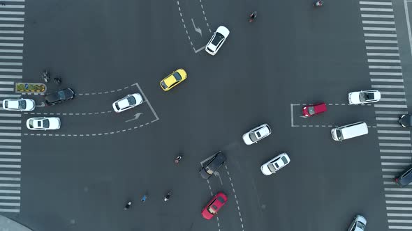 Aerial Drone Shot of Crossroad in the City Cars and Buses Driving By Avenue alt