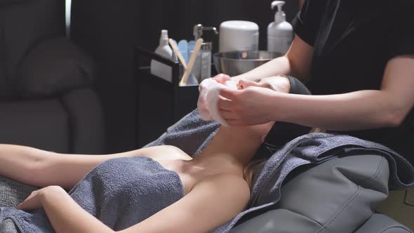 Young Women at the Spa Enjoy Facial and Cleavage Treatments alt