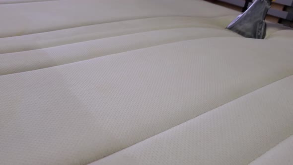 Dry Cleaning of the Mattress. Dry Cleaning at home.Close-up alt